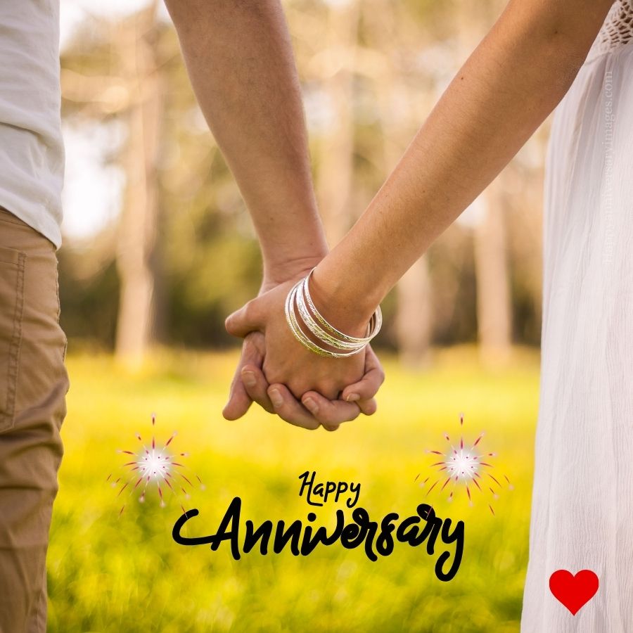 happy anniversary image with couple hands in hands